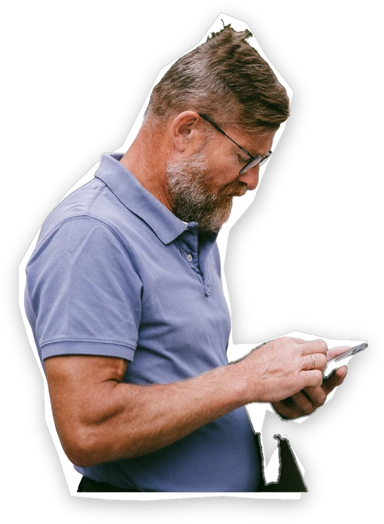 A man reading a message on his phone